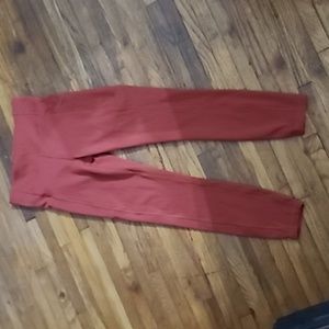 Lululemon rust colored size 6 leggings. Side pocket. Adjustable waist.